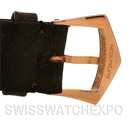 This image shows the buckle and strap of a Vintage Patek Philippe watch, focusing on the engraved buckle details.