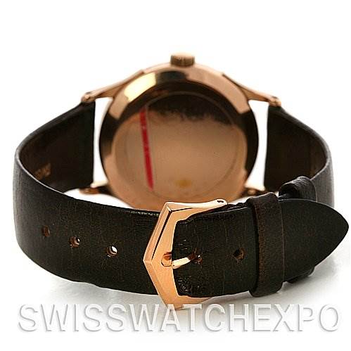The image shows the back view of a Vintage Patek Philippe watch, highlighting the leather strap and gold buckle.