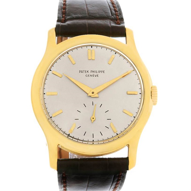 This Vintage Patek Philippe watch is shown from the front, displaying its dial, hands, case, and leather strap.