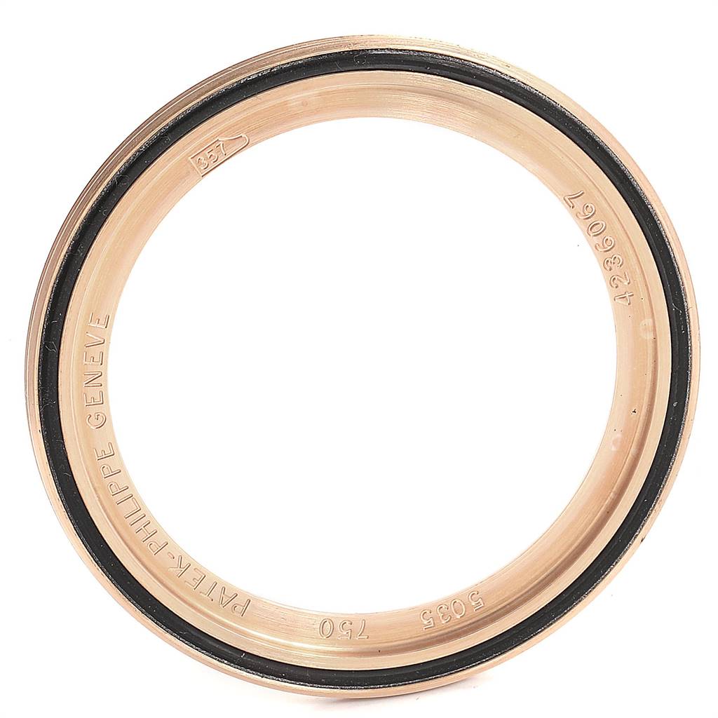 This image shows a close-up of the bezel from a Patek Philippe 5035R Men
s Rose Gold Silver Dial 5035R Men
s Rose Gold Silver Dial Complicated Annual Calendar Rose Gold 5035 watch.