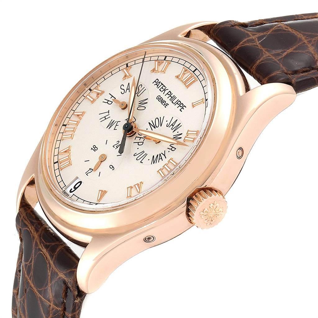 The image shows the Patek Philippe 5035R Men
s Rose Gold Silver Dial 5035R Men
s Rose Gold Silver Dial Complicated Annual Calendar Rose Gold Men
s Watch 5035 from a side angle, highlighting the face, bezel, crown, and strap.