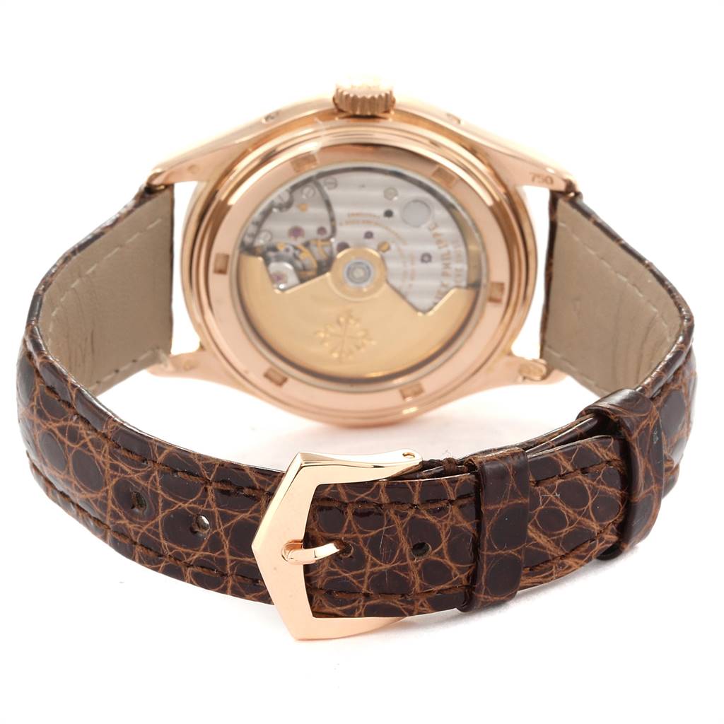 This Patek Philippe 5035R Men
s Rose Gold Silver Dial 5035R Men
s Rose Gold Silver Dial Complicated Annual Calendar Rose Gold Mens Watch 5035 is shown from the back, displaying the movement and leather strap.