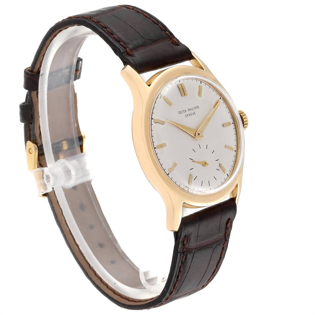 The image shows a side angle of the Vintage Patek Philippe watch, highlighting the face, gold case, and leather strap.