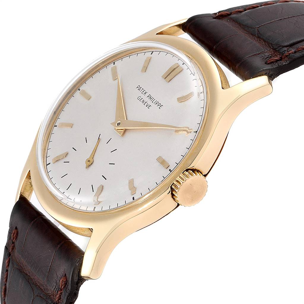 This image shows a side angle of the vintage Patek Philippe watch, highlighting the dial, crown, and leather strap.