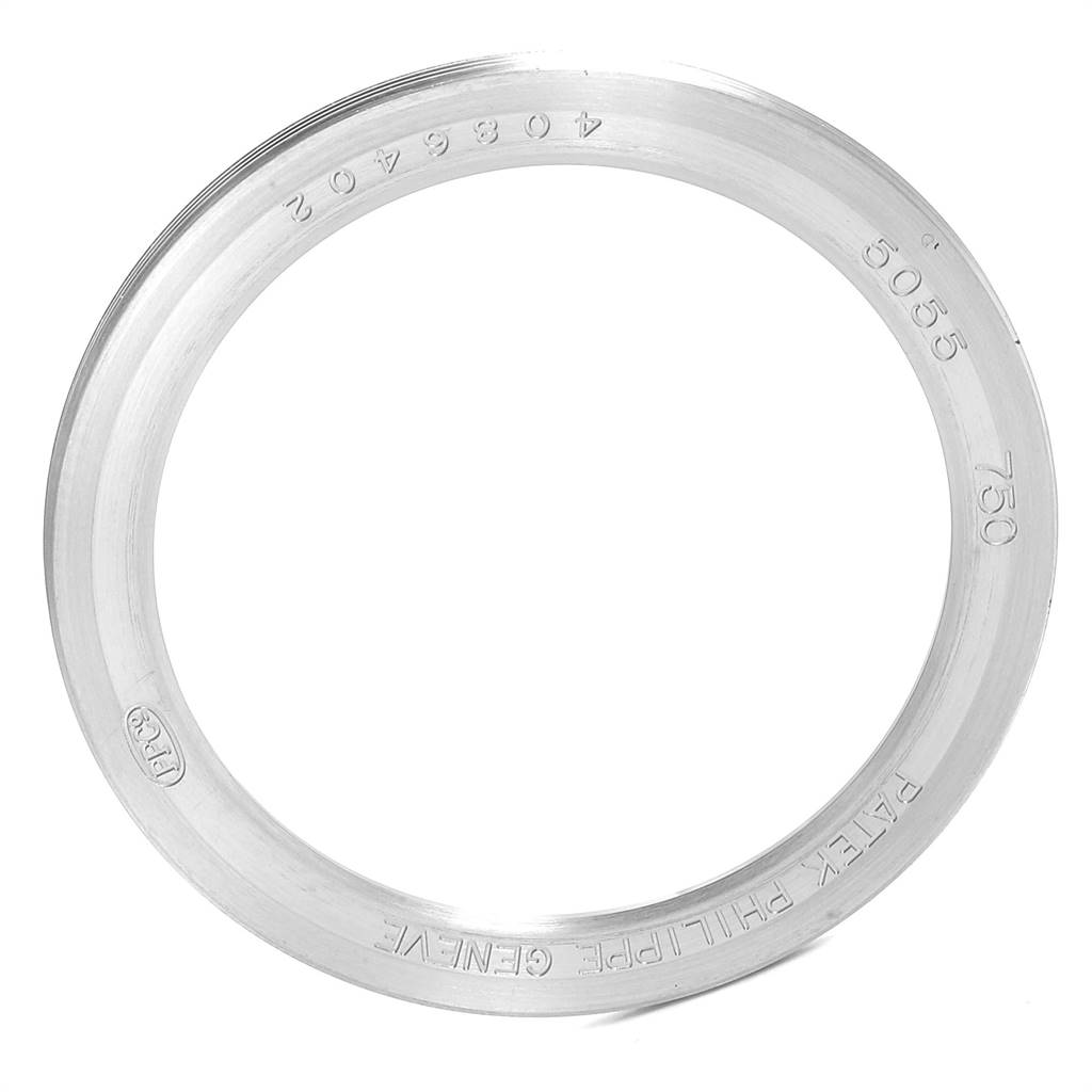 This image shows the bezel ring of a Patek Philippe 5055G Men's White Gold Black Dial 5055G Men's White Gold Black Dial Moonphase Power Reserve White Gold Automatic Watch 5055 model.