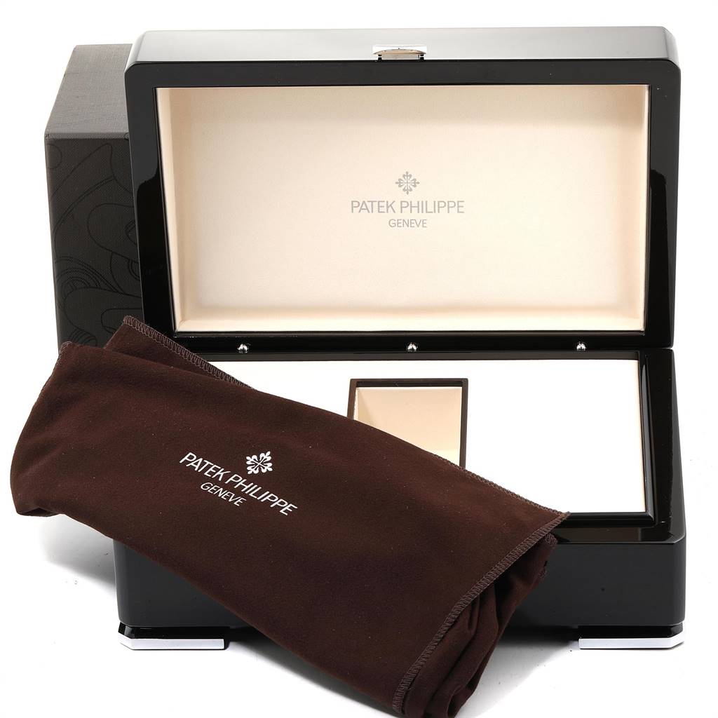 The image shows the packaging for a Patek Philippe 5055G Men's White Gold Black Dial 5055G Men's White Gold Black Dial Moonphase Power Reserve White Gold Automatic Watch 5055, including the box and cloth.