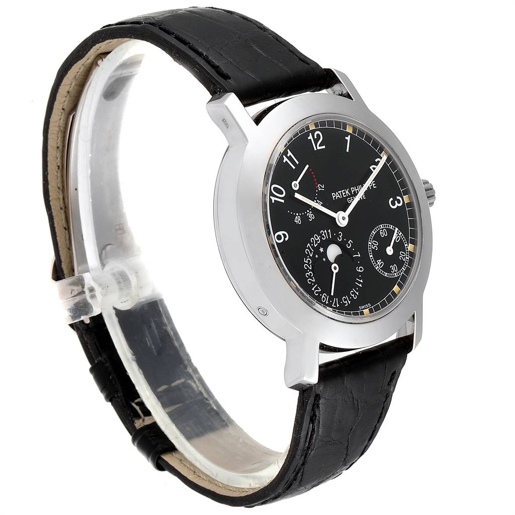 The Patek Philippe 5055G Men's White Gold Black Dial 5055G Men's White Gold Black Dial Moonphase Power Reserve White Gold Automatic Watch 5055 model is shown at a left-side angle, highlighting its black dial and leather strap.