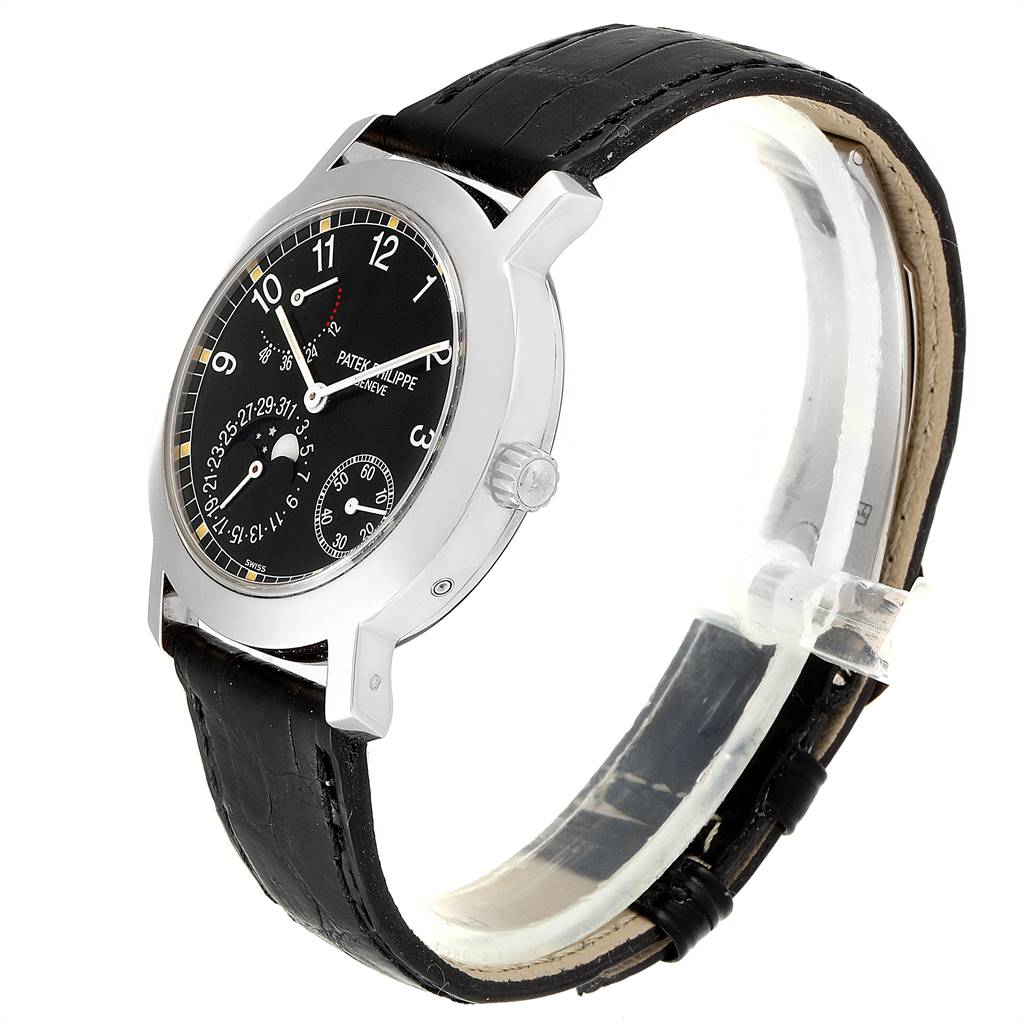 The image shows a side angle of the Patek Philippe 5055G Men's White Gold Black Dial 5055G Men's White Gold Black Dial Moonphase Power Reserve White Gold Automatic Watch 5055, highlighting the watch face and strap.