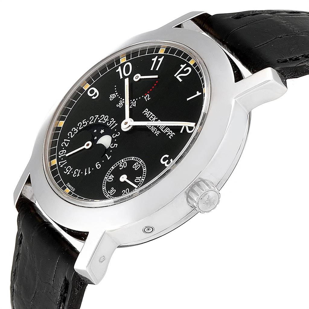 The image shows a Patek Philippe 5055G Men's White Gold Black Dial 5055G Men's White Gold Black Dial Moonphase Power Reserve 5055 automatic watch in white gold, viewed from a tilted angle highlighting the face, case, and crown.