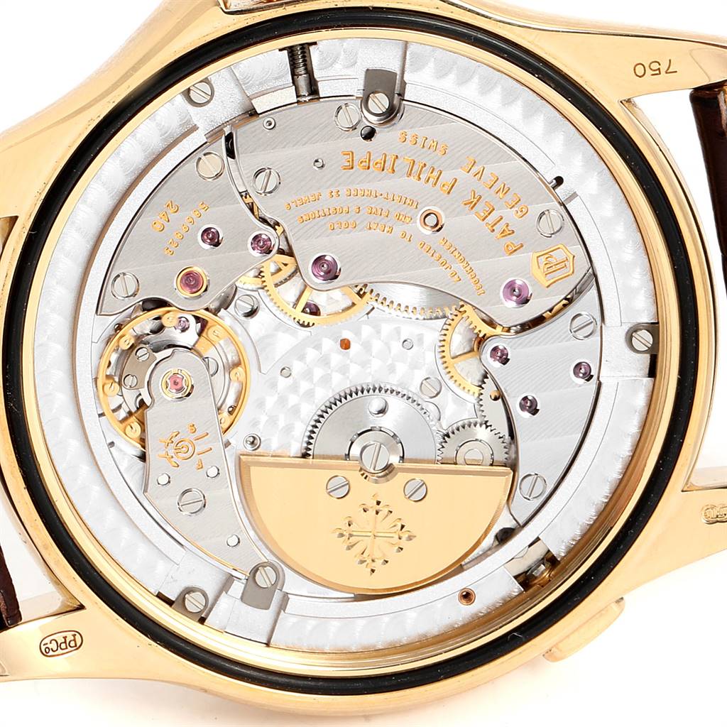 The image shows a close-up of the back view of the Patek Philippe Complications 5130J Men's Yellow Gold Silver Dial 5130J Men's Yellow Gold Silver Dial model, revealing its intricate mechanical movement.