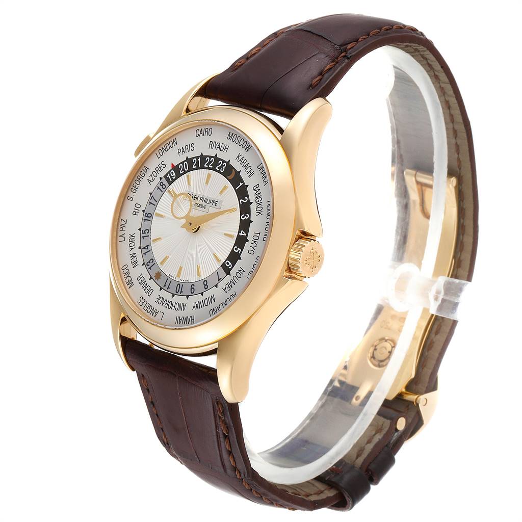 The image shows a Complications model by Patek Philippe at a three-quarter angle, highlighting the face, crown, and leather strap.