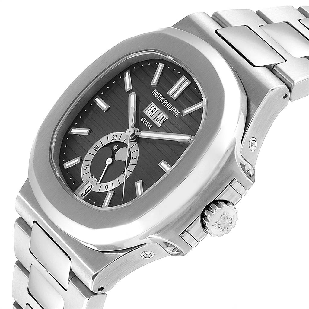 The image shows a side angle of the Patek Philippe Nautilus 5726/1A-001 Men's Stainless Steel Black Dial 5726/1A-001 Men's Stainless Steel Black Dial watch, featuring its bracelet, crown, and dial.