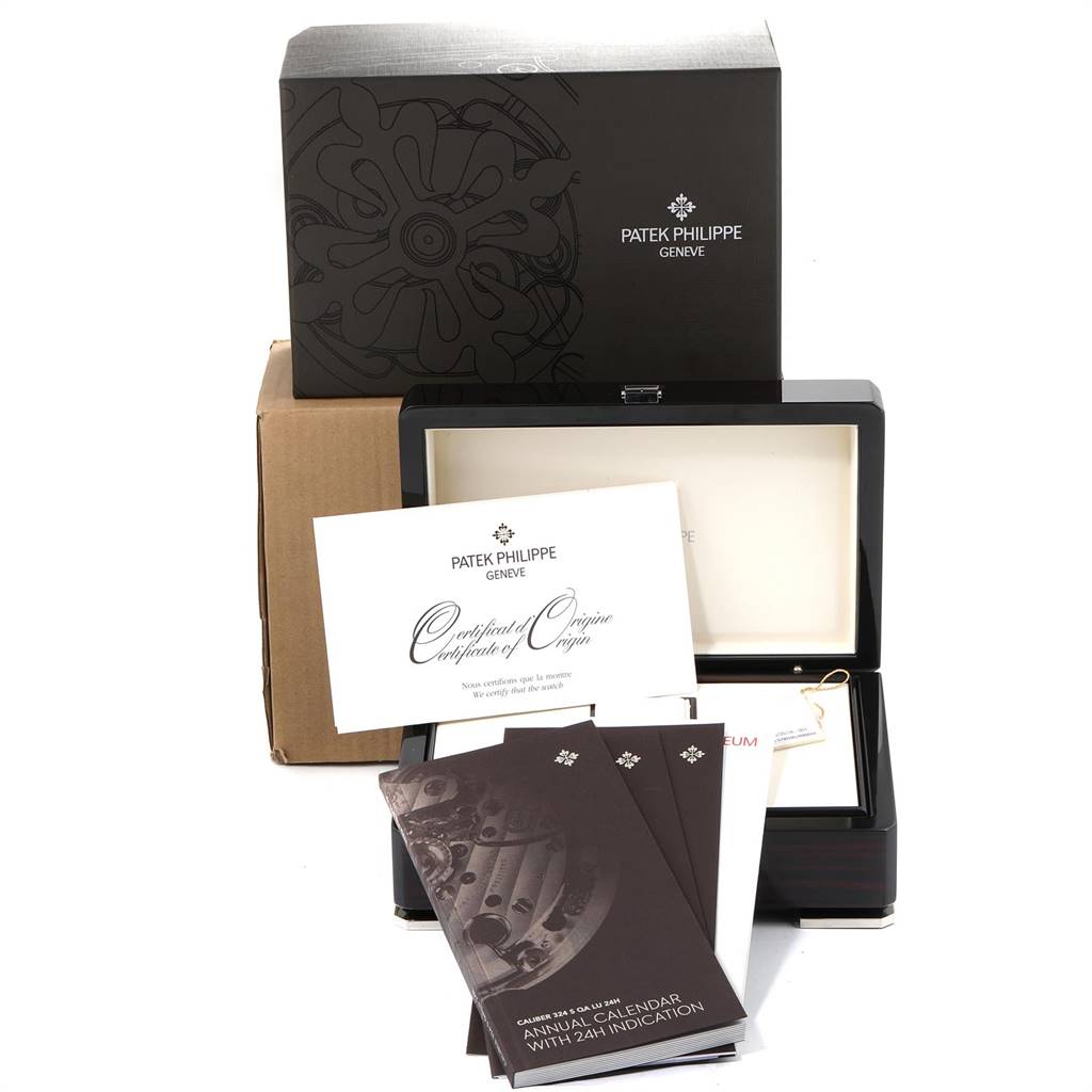 The image shows the packaging and documentation for a Patek Philippe Nautilus 5726/1A-001 Men's Stainless Steel Black Dial 5726/1A-001 Men's Stainless Steel Black Dial watch, including the box and certificates.