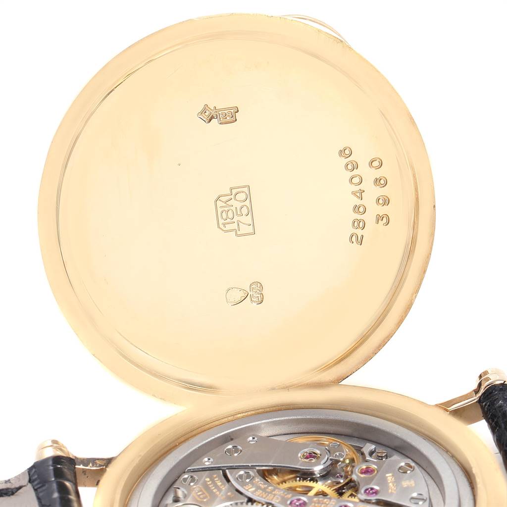 The image shows the open case back of a Patek Philippe Calatrava 3960 Men's Yellow Gold White Dial 3960 Men's Yellow Gold White Dial, revealing the movement and inner case engravings.