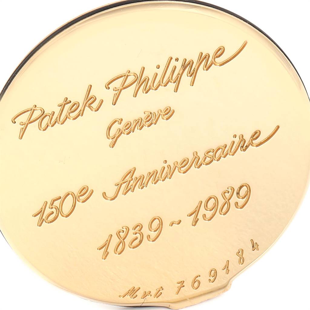 This image shows the gold back case of a Patek Philippe Calatrava 3960 Men's Yellow Gold White Dial 3960 Men's Yellow Gold White Dial model, commemorating its 150th anniversary (1839-1989).