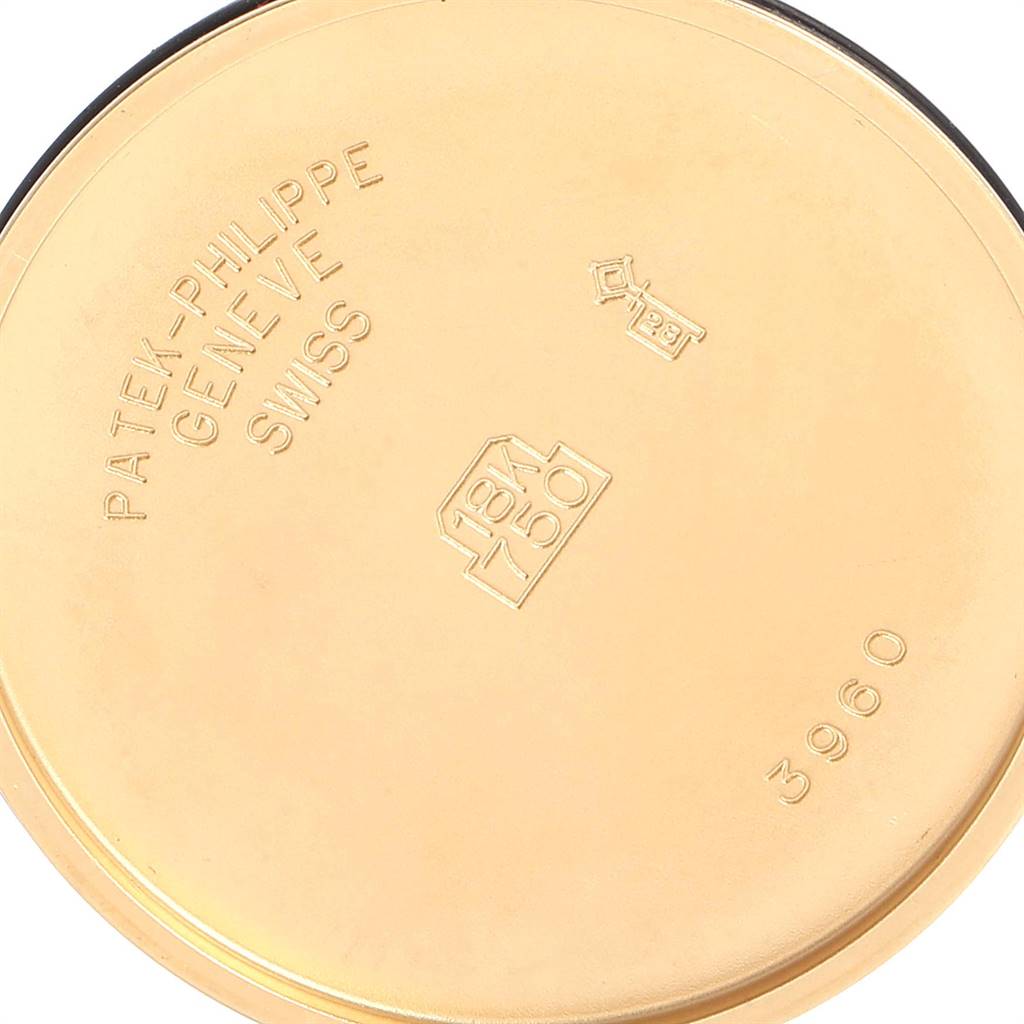 This image shows the gold case back of a Patek Philippe Calatrava 3960 Men's Yellow Gold White Dial 3960 Men's Yellow Gold White Dial model, displaying hallmark stamps and the model number 3960.