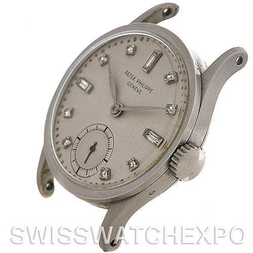 This image shows a side-angle view of a Vintage Patek Philippe watch face, crown, and lugs, without a strap.