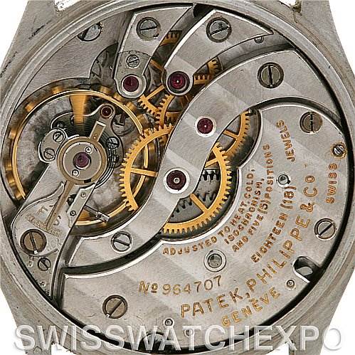 This is an image showing the intricate inner mechanics and movement of a Vintage Patek Philippe watch viewed from the back.