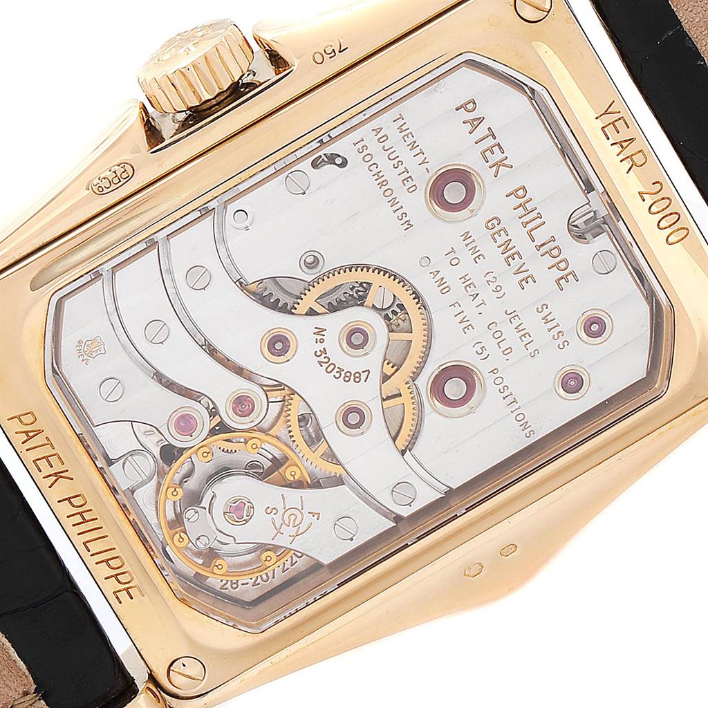 The image shows the back casing and internal mechanism of the Patek Philippe Gondolo 5100J Men's Yellow Gold Silver Dial 5100J Men's Yellow Gold Silver Dial watch, with the crown and part of the strap visible.