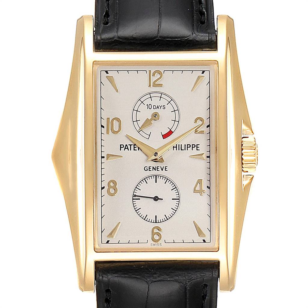 The image shows a frontal view of the Patek Philippe Gondolo 5100J Men's Yellow Gold Silver Dial 5100J Men's Yellow Gold Silver Dial watch, highlighting its rectangular face, two subdials, and gold case.