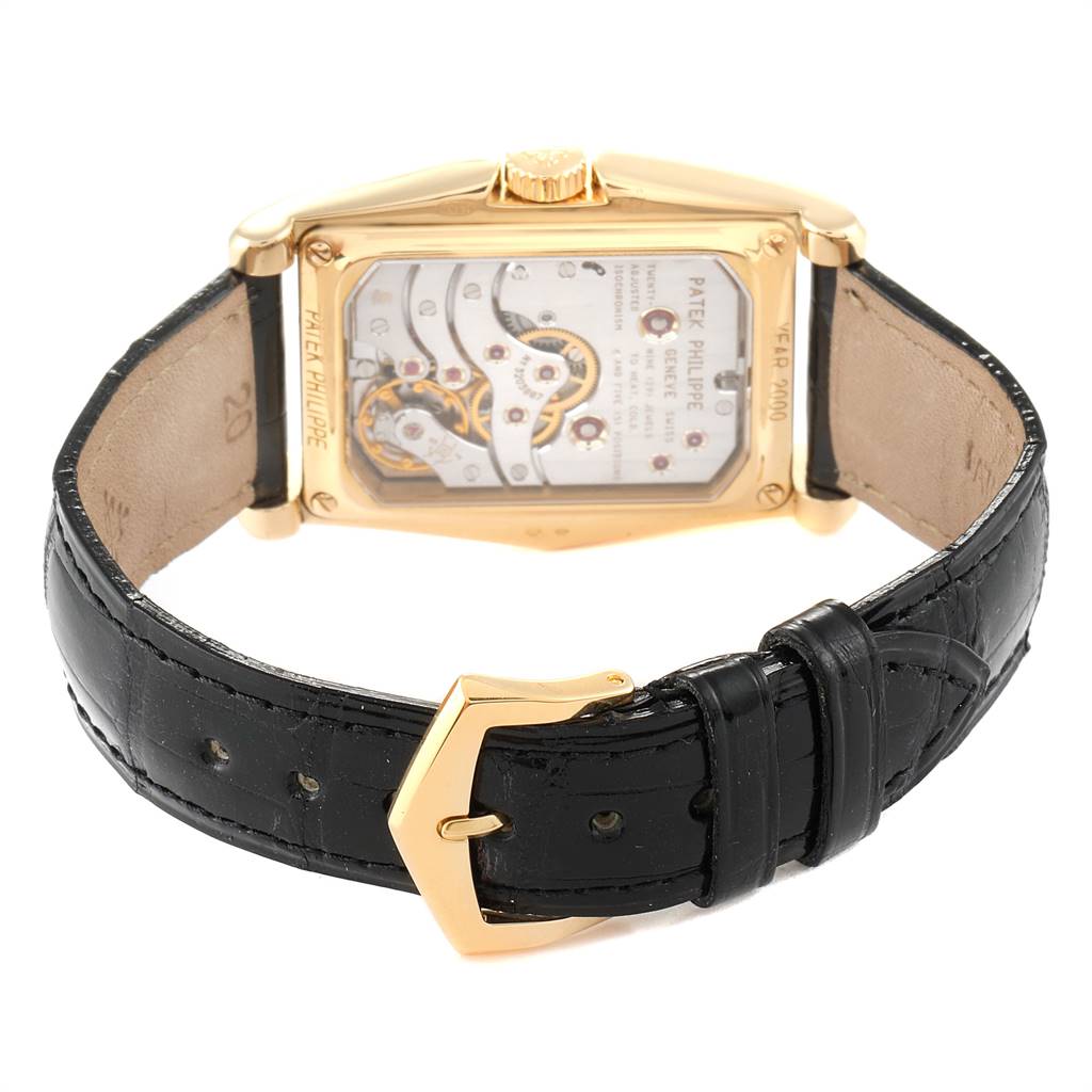 This image shows the back view of the Patek Philippe Gondolo 5100J Men's Yellow Gold Silver Dial 5100J Men's Yellow Gold Silver Dial watch, focusing on the movement and black leather strap.