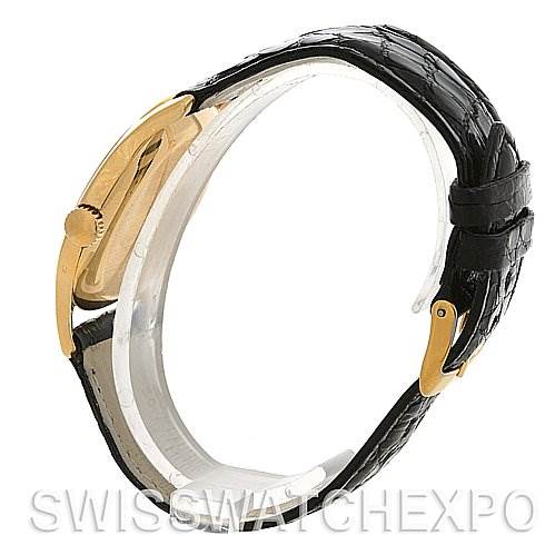 This image shows a side profile of a Vintage Patek Philippe watch, highlighting the watch case, crown, and black leather strap.