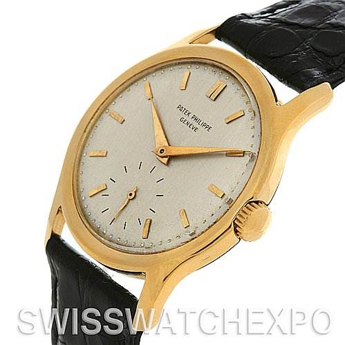 The image shows a side-angle view of a Vintage Patek Philippe watch, highlighting the dial, crown, and leather strap.