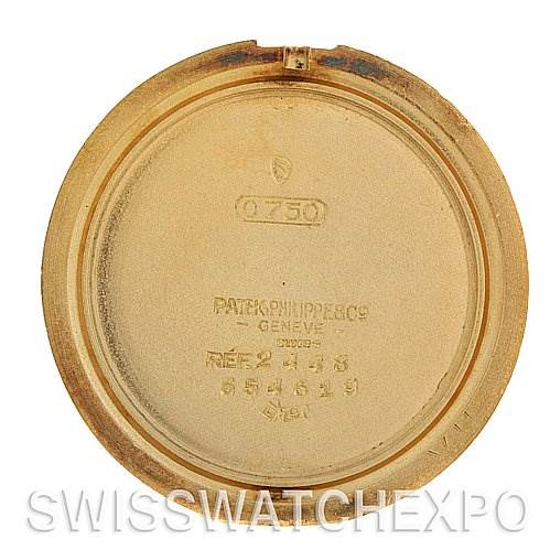 This image shows the inside of the case back of a Vintage Patek Philippe watch, featuring engraved markings and numbers.