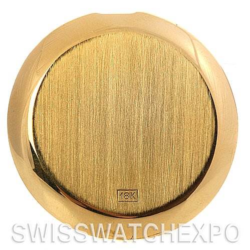 This image shows the back case of a vintage Patek Philippe watch in 18K gold, viewed from a top-down angle.