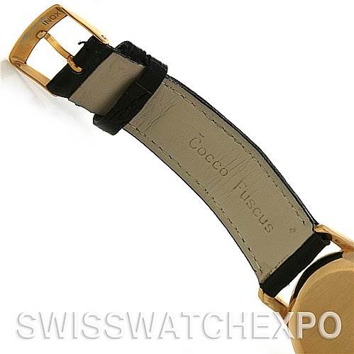 The image shows the underside of the strap and part of the case of a vintage Patek Philippe watch, viewed from an angle.