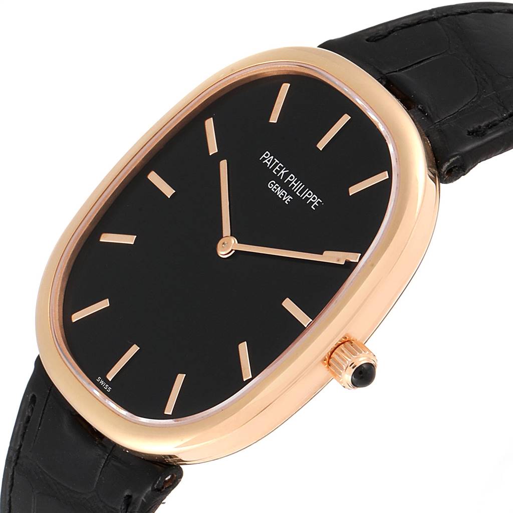 The image shows a side angle view of the Patek Philippe Golden Ellipse 5738R Men's Rose Gold Black Dial 5738R Men's Rose Gold Black Dial model, displaying its dial, case, crown, and leather strap.