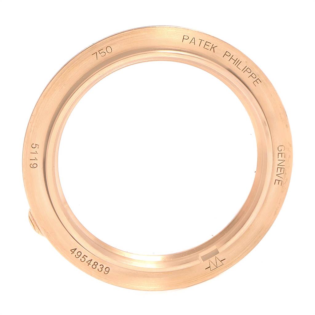This image shows the gold case back ring of a Patek Philippe Calatrava 5119R Men's Rose Gold White Dial 5119R Men's Rose Gold White Dial model 5119 watch from a top-down angle.