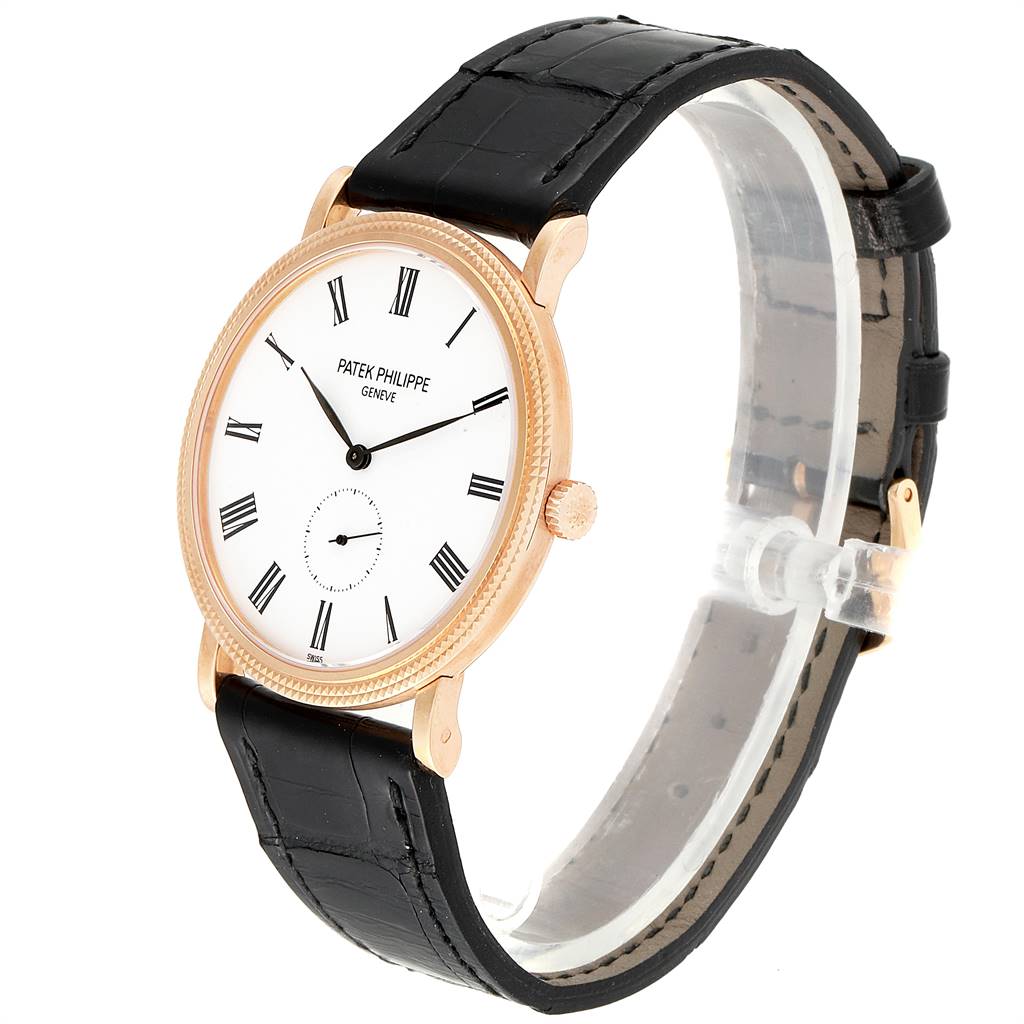 This image shows a Patek Philippe Calatrava 5119R Men's Rose Gold White Dial 5119R Men's Rose Gold White Dial watch at a slight side angle, displaying its dial, case, strap, and crown.