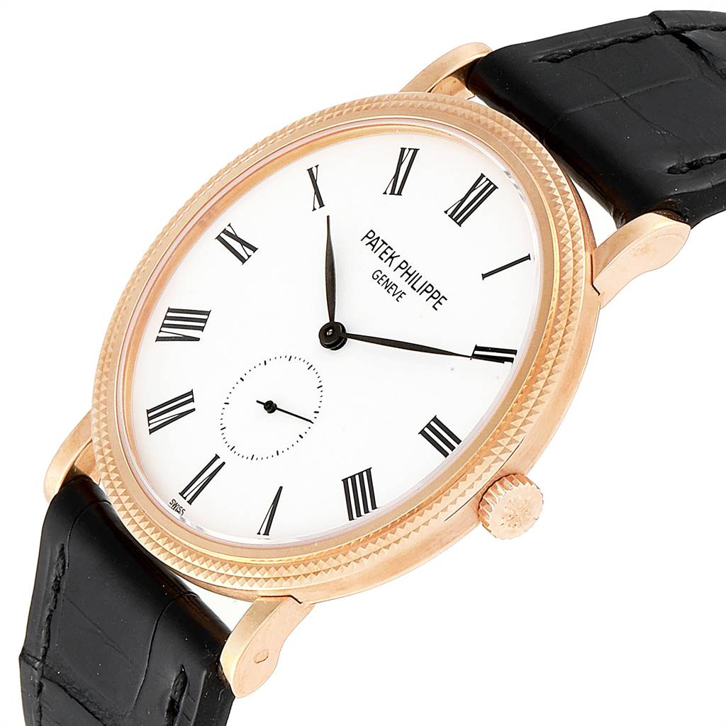 The watch shown is a Patek Philippe Calatrava 5119R Men's Rose Gold White Dial 5119R Men's Rose Gold White Dial model, viewed at an oblique angle showcasing the dial, hands, crown, and part of the strap.