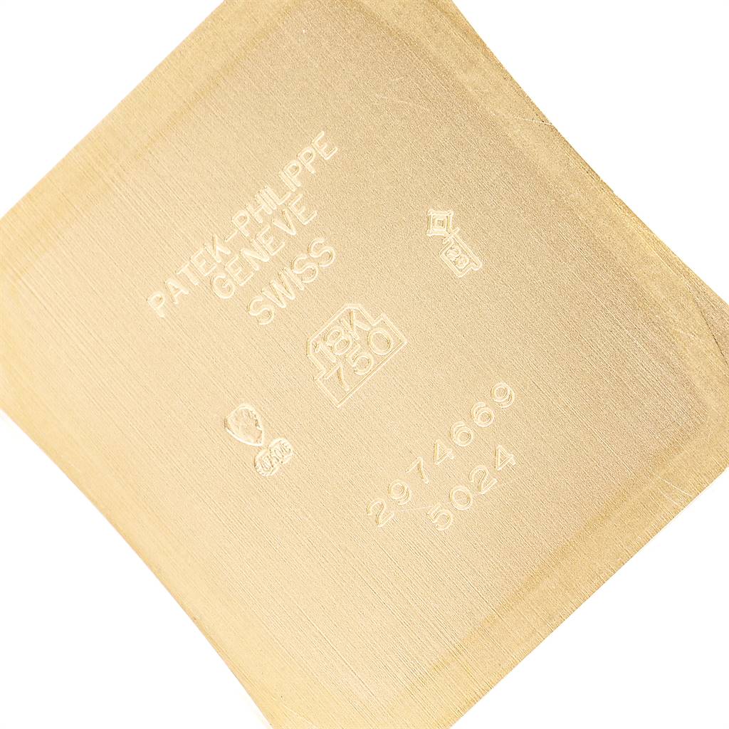 This is the inner side of the case back of a Patek Philippe Gondolo 5024J Men's Yellow Gold White Dial 5024J Men's Yellow Gold White Dial watch, showing engraving and hallmarks.