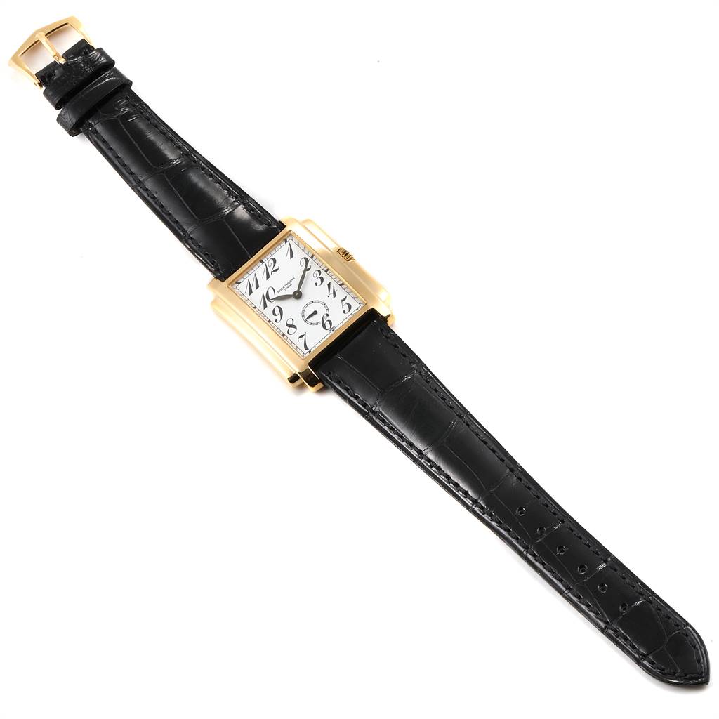 This image shows a Patek Philippe Gondolo 5024J Men's Yellow Gold White Dial 5024J Men's Yellow Gold White Dial watch from a top-down angle, displaying both the face and the entire black leather strap.