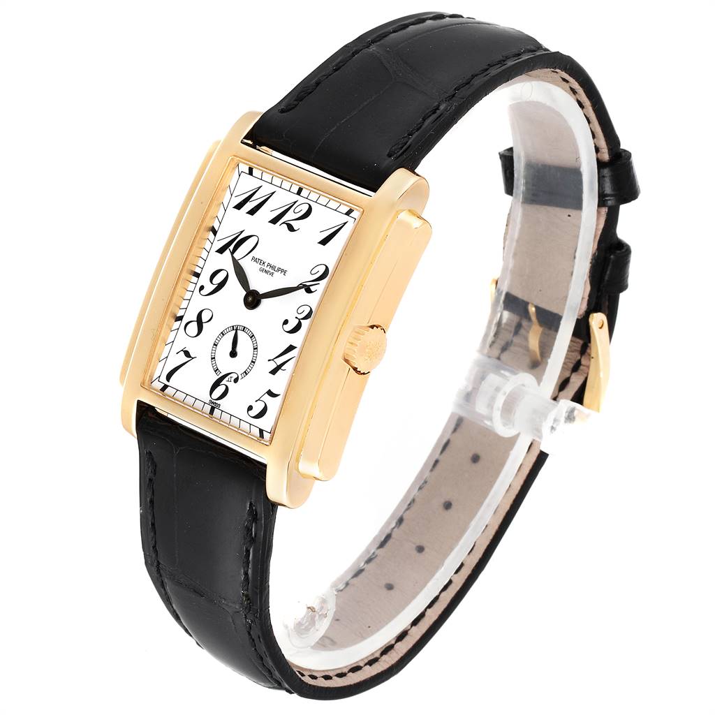 The Patek Philippe Gondolo 5024J Men's Yellow Gold White Dial 5024J Men's Yellow Gold White Dial watch is shown at a slight angle, revealing its gold case, white dial, black strap, and crown.