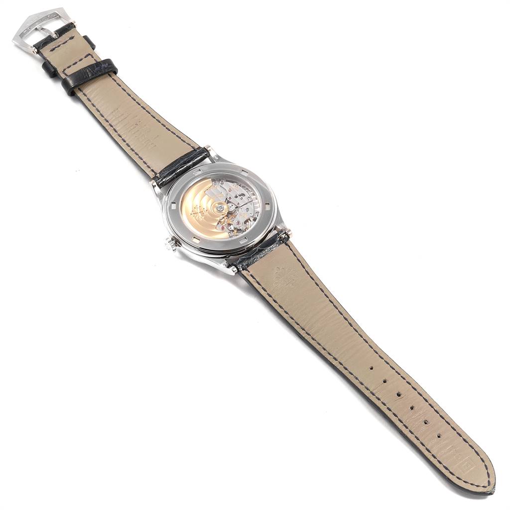 The image shows the back view of a Patek Philippe Calatrava 5296G Men
s White Gold Silver Dial 5296G Men
s White Gold Silver Dial watch, highlighting the movement and leather strap.