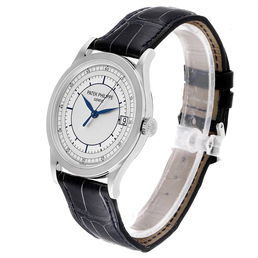 The image shows a side angle of a Patek Philippe Calatrava 5296G Men
s White Gold Silver Dial 5296G Men
s White Gold Silver Dial watch featuring its dial, crown, and leather strap.
