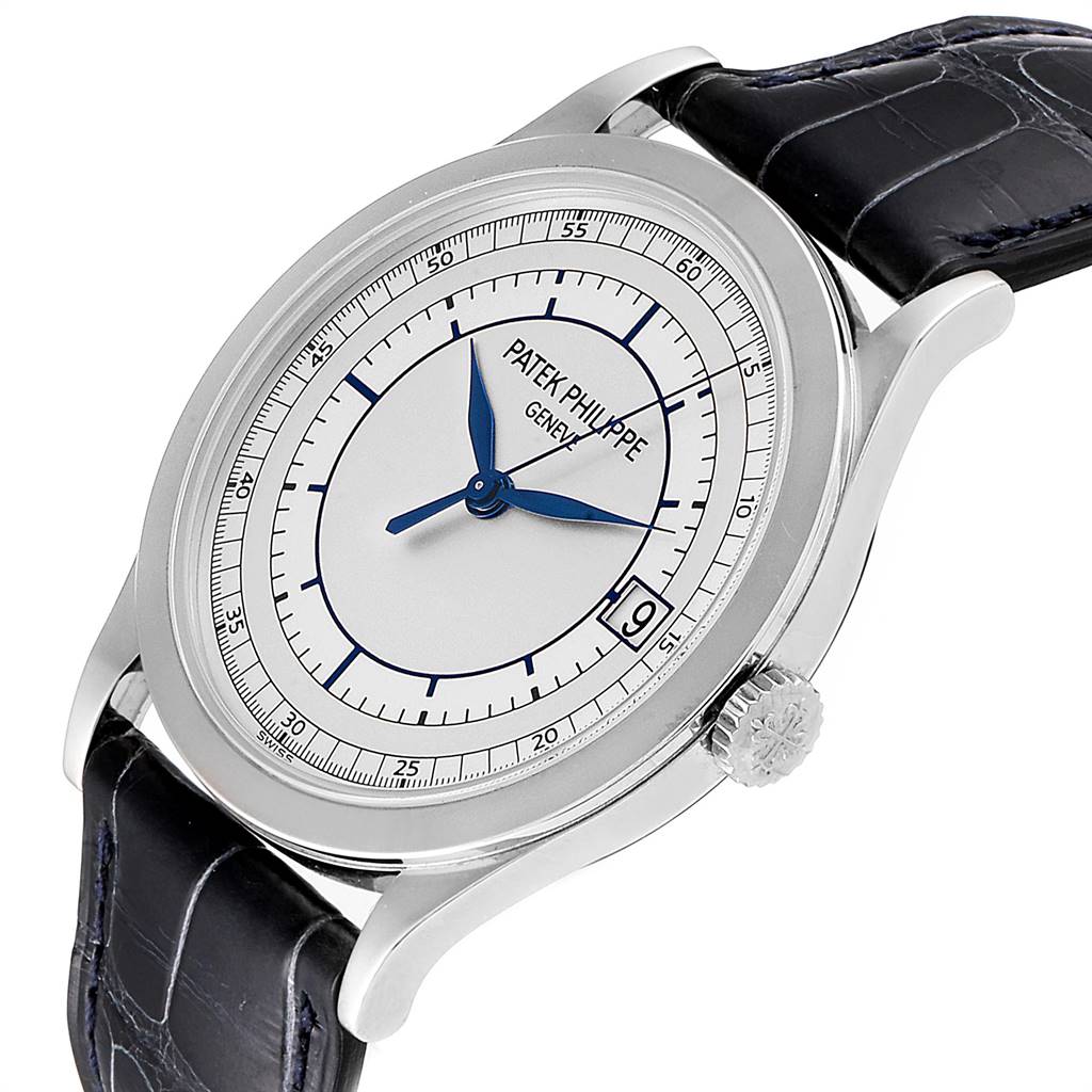 The image shows a Patek Philippe Calatrava 5296G Men
s White Gold Silver Dial 5296G Men
s White Gold Silver Dial watch at a three-quarter angle, displaying its dial, crown, and strap.