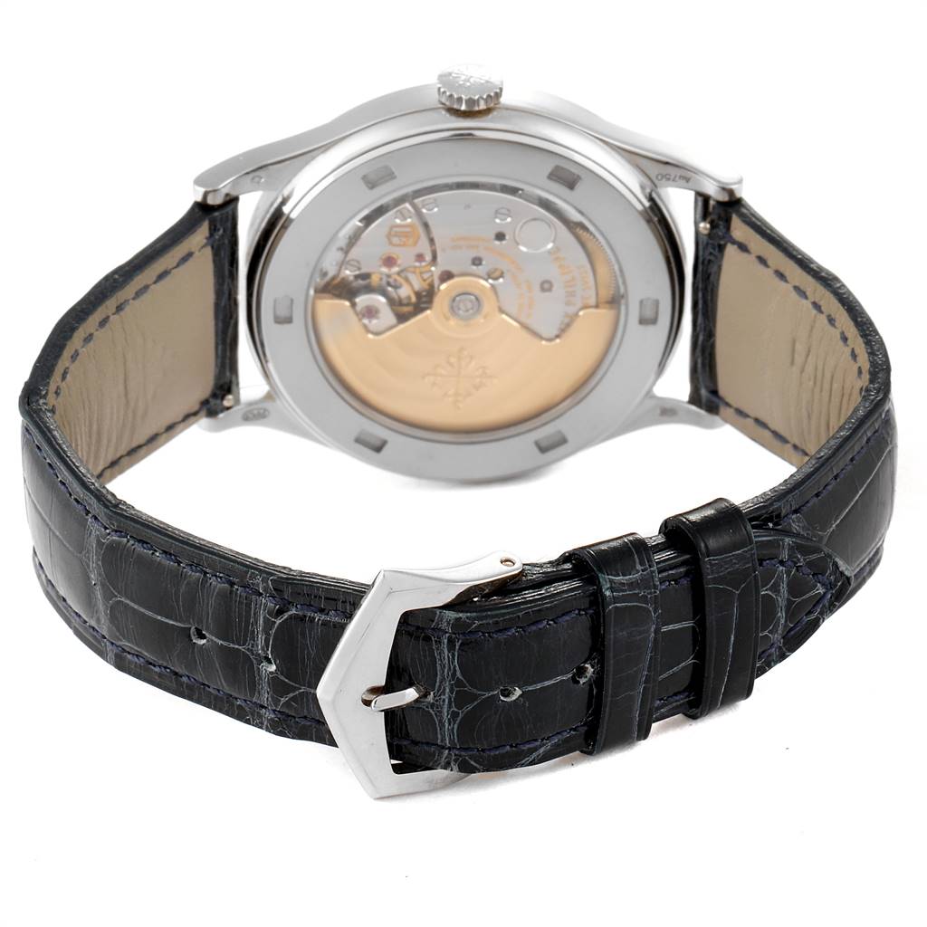 The image shows the back view of a Patek Philippe Calatrava 5296G Men
s White Gold Silver Dial 5296G Men
s White Gold Silver Dial watch, displaying its buckle and mechanical movement.