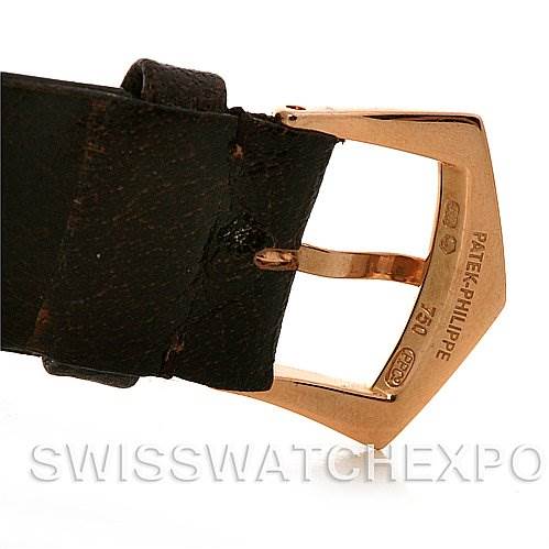 The image shows the buckle and strap of a Vintage Patek Philippe watch, focusing on the gold buckle with engraved details.