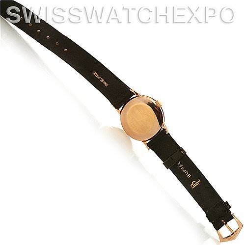 This image shows the back of a Vintage Patek Philippe watch, highlighting its leather strap and buckle from a top-down angle.