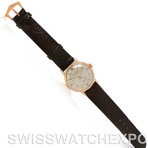 The image shows a full front view of a Vintage Patek Philippe watch, highlighting the dial, leather strap, and buckle.