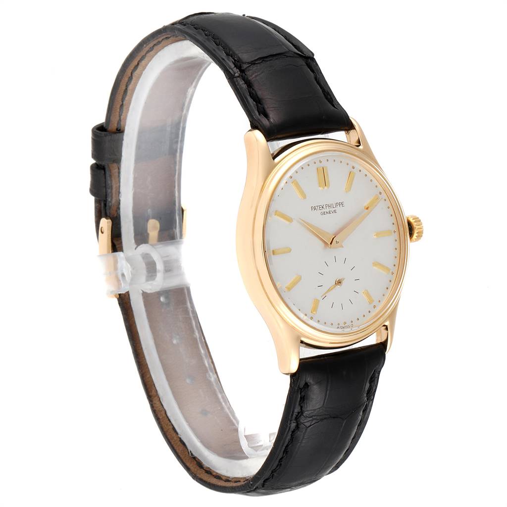 The image shows a side view of the Calatrava model watch by Patek Philippe, featuring the face, strap, and crown.