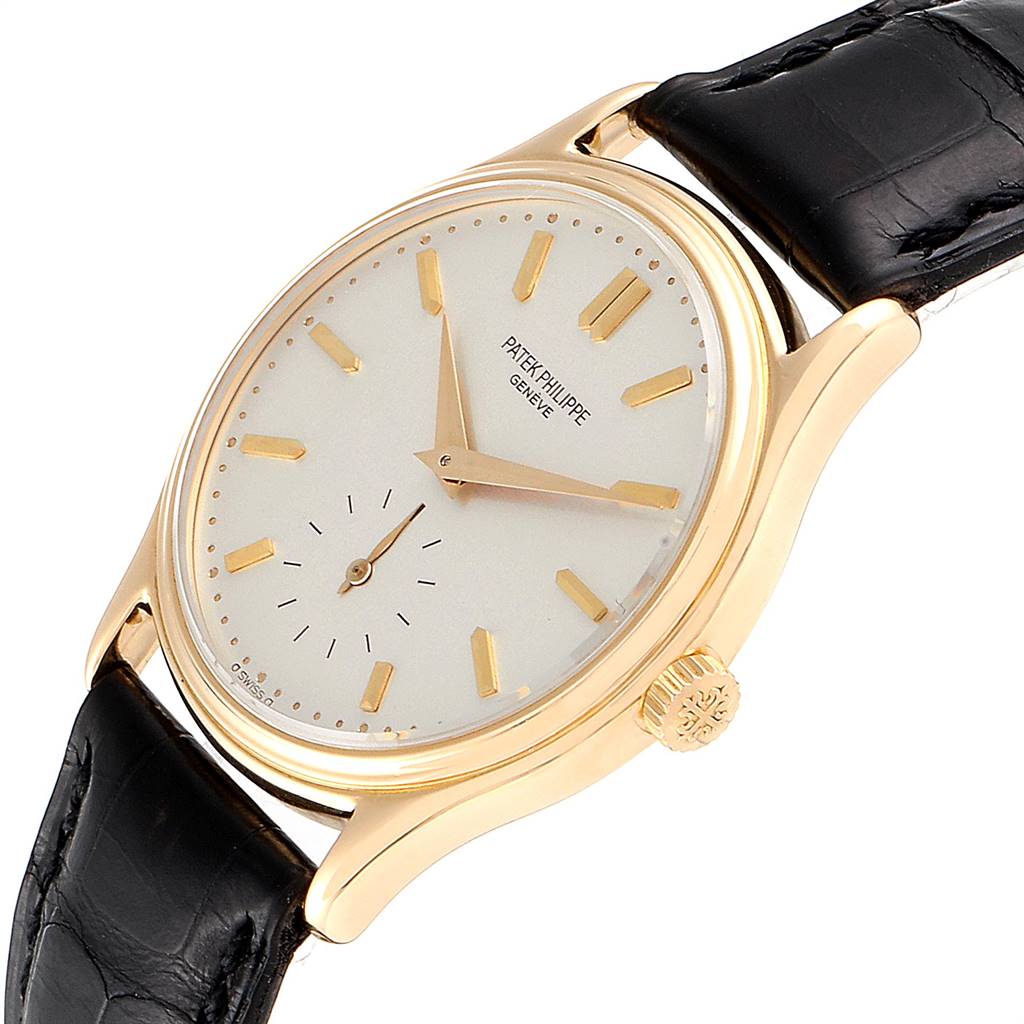 The image shows a Patek Philippe Calatrava 3923 Men
s Yellow Gold Silver Dial 3923 Men
s Yellow Gold Silver Dial watch at a slightly angled top-down view, highlighting the face, bezel, crown, and black leather strap.
