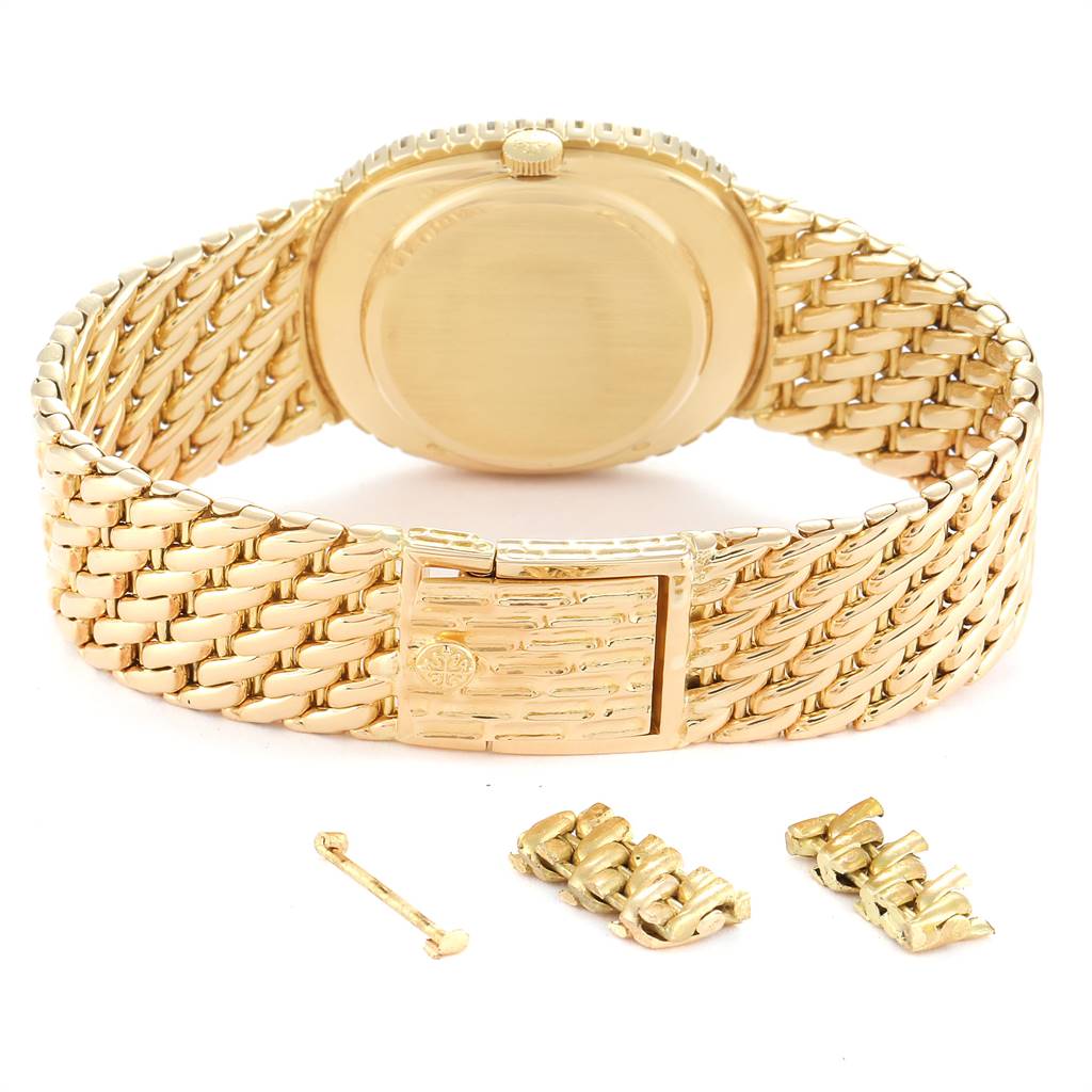 This image shows the back view of the Patek Philippe 3748 Yellow Gold Blue Dial 3748 Yellow Gold Blue Dial Golden Ellipse Blue Dial Yellow Gold Diamond Watch 3748 model along with its clasp and links.