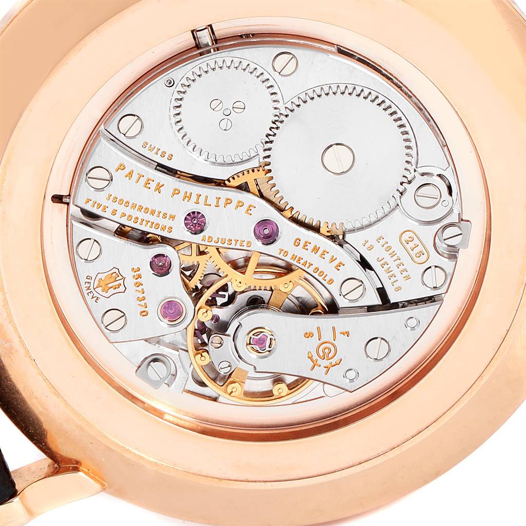 This image shows the intricate mechanism and internal components of the Patek Philippe Calatrava 5119R Men's Rose Gold White Dial 5119R Men's Rose Gold White Dial watch from a rear angle.