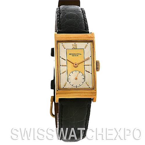 This image shows a front view of a Vintage Patek Philippe watch with a rectangular case and a black leather strap.