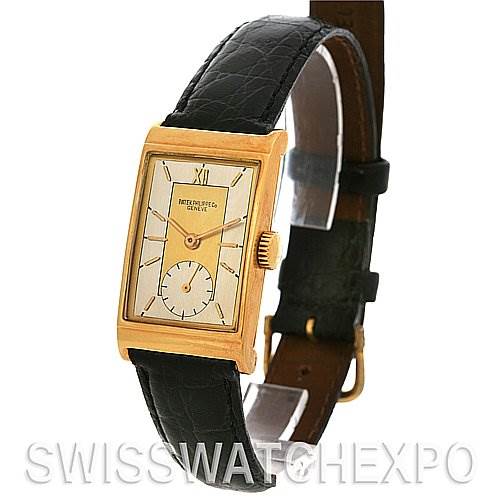 This image shows a front angled view of a rectangular vintage Patek Philippe watch with a black leather strap.